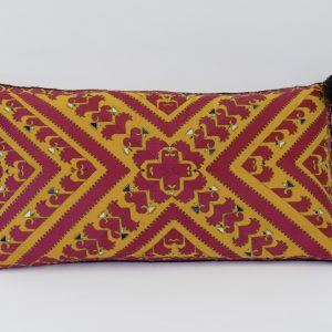 original hand embroidered tribal cushion with intricate geometrical design in red stitching on yellow linen