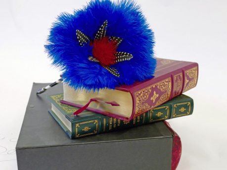 Pen with dyed blue and red Ostrich feathers