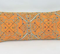 Rectangular, hand-embroidered cushion - mainly yellow with intricate jewel coloured chevrons