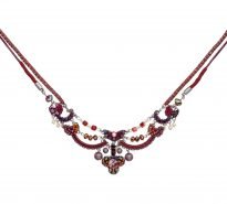 Intricate necklace made using a combination of beads, crystals, embroidery and textiles