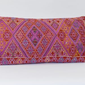 Rectangular, embroidered Dowry cushion - mainly pink with some red and yellow geometric triangles