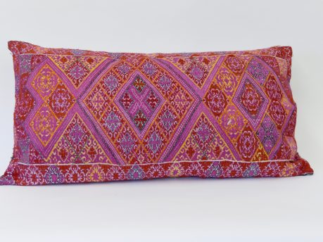 Rectangular, embroidered Dowry cushion - mainly pink with some red and yellow geometric triangles