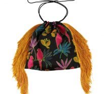 Black silk drawstring evening bag with long yellow fringe and featuring hot pink parrots and tropical design.